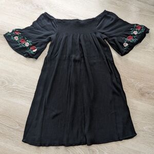 Black off the shoulder dress with rose embroidered sleeves